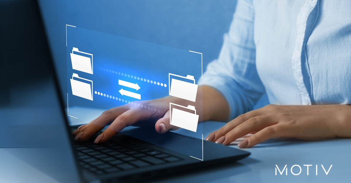 Data transfer between systems on laptop, representing structured migration and organized workflow processing